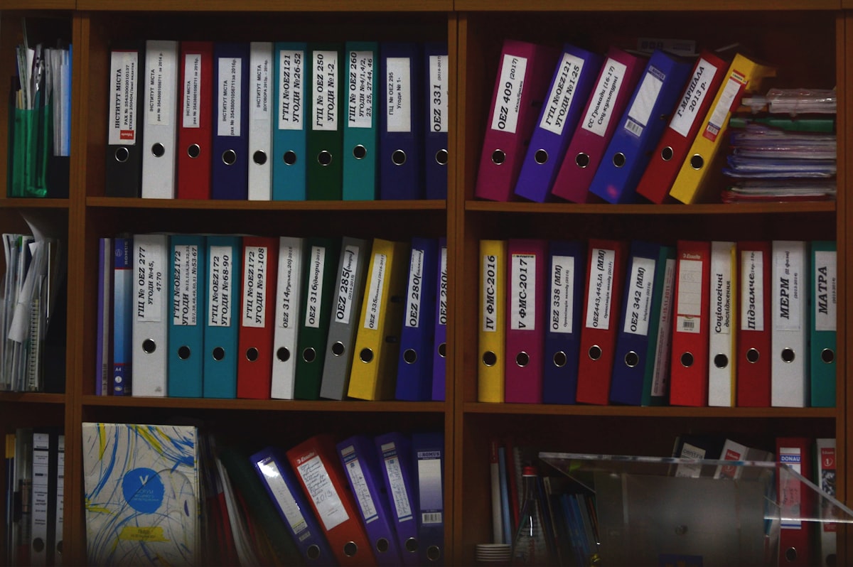 SDS safety data sheet binders organized on office shelf
